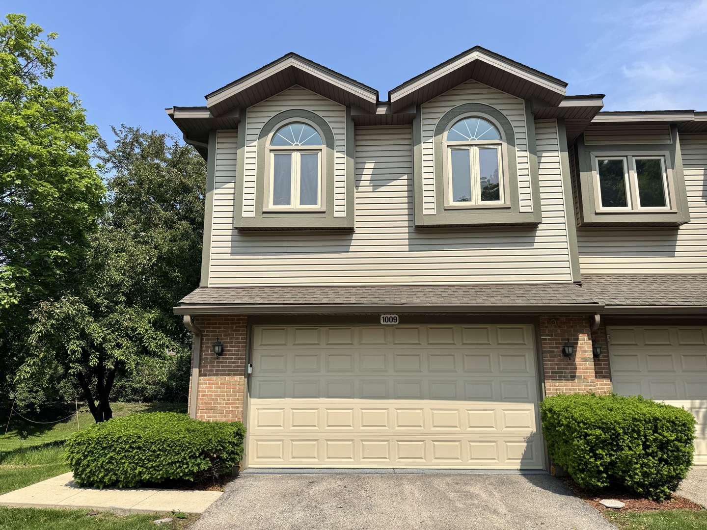 a front view of a house with garage