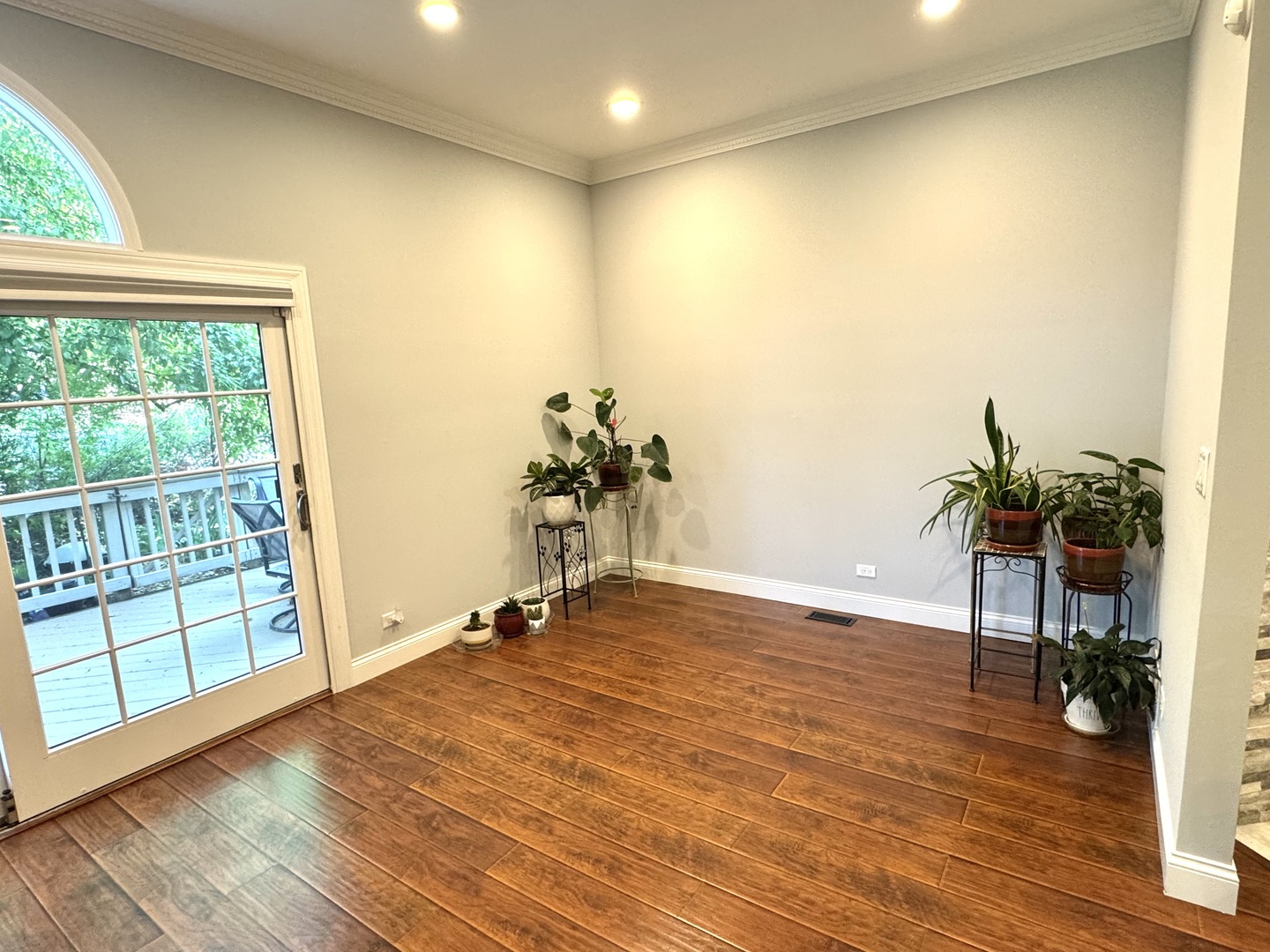 1009 Arbor Court Mount Prospect, IL 60056 - Photo 11 of 35 an empty room with wooden floor and windows