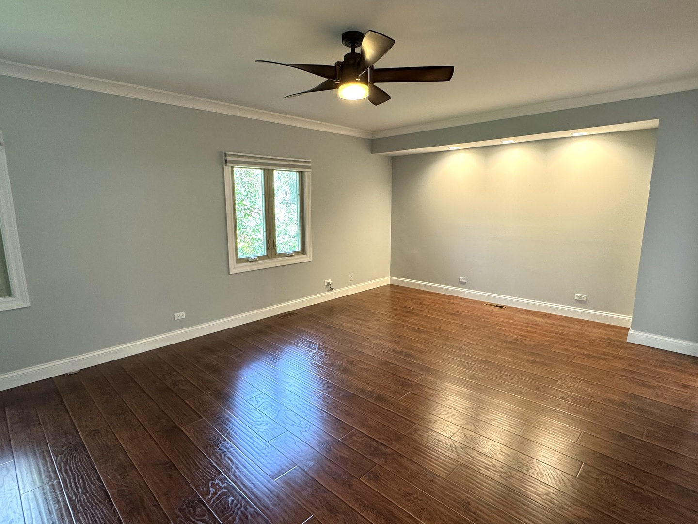 1009 Arbor Court Mount Prospect, IL 60056 - Photo 17 of 35 a view of empty room with wooden floor and fan
