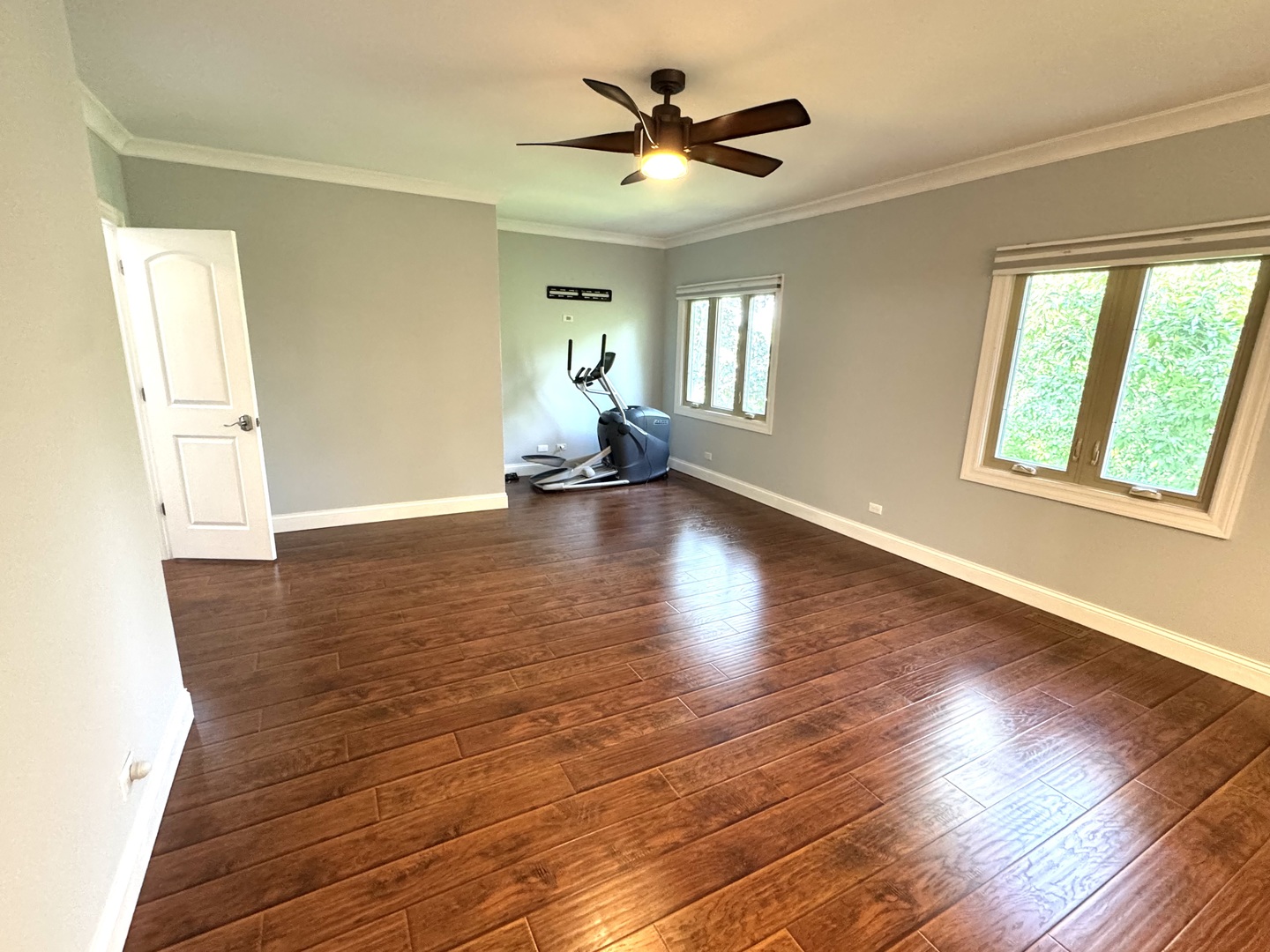 1009 Arbor Court Mount Prospect, IL 60056 - Photo 19 of 35 a view of an empty room with a window and wooden floor