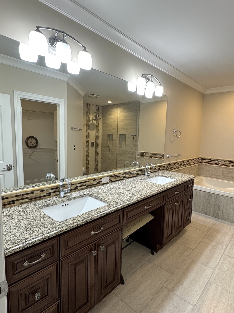 1009 Arbor Court Mount Prospect, IL 60056 - Photo 20 of 35 a bathroom with a sink double vanity and a mirror