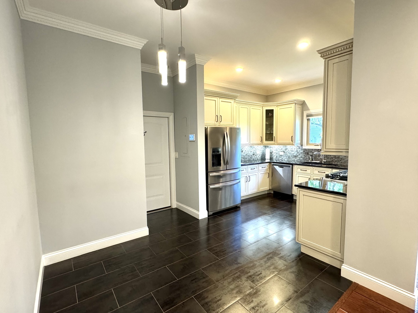 1009 Arbor Court Mount Prospect, IL 60056 - Photo 2 of 35 a view of a kitchen with a sink a refrigerator and wooden floor