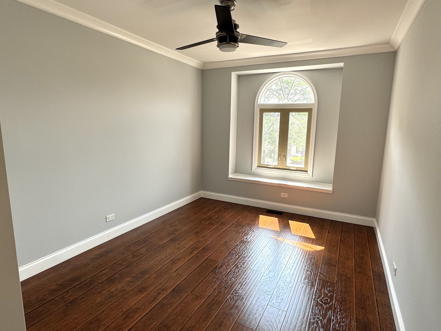 1009 Arbor Court Mount Prospect, IL 60056 - Photo 24 of 35 a view of an empty room with wooden floor and a window