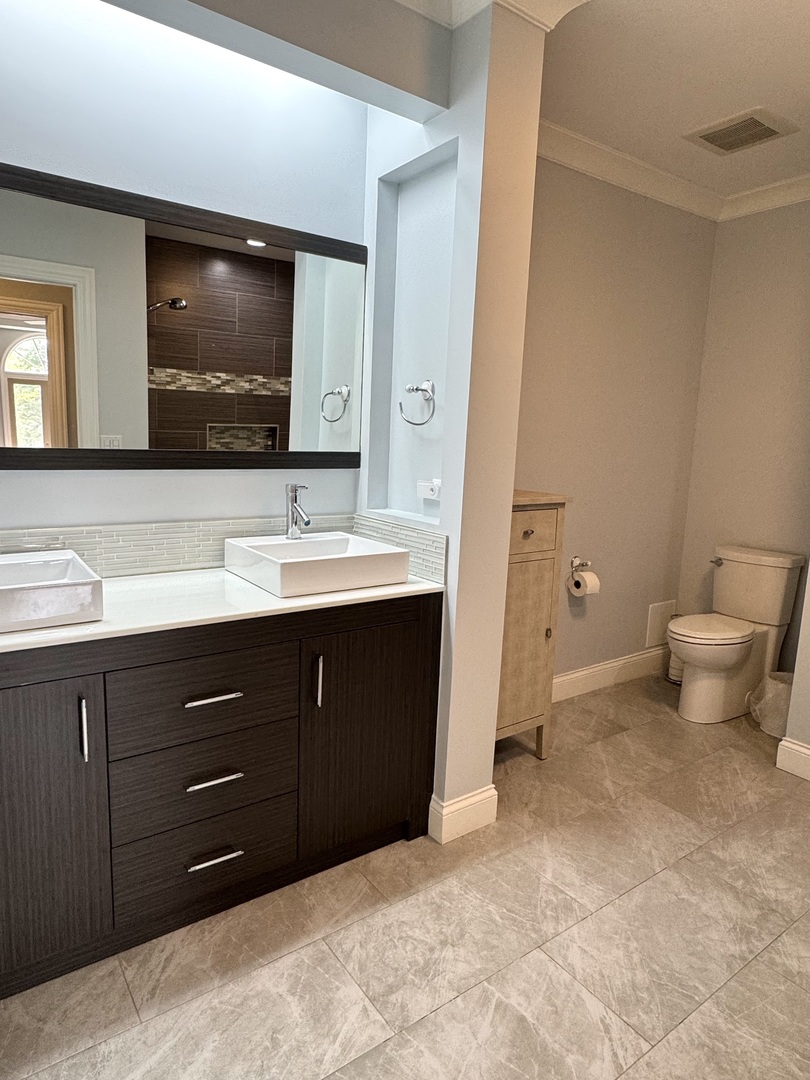 1009 Arbor Court Mount Prospect, IL 60056 - Photo 28 of 35 a bathroom with a toilet sink and mirror