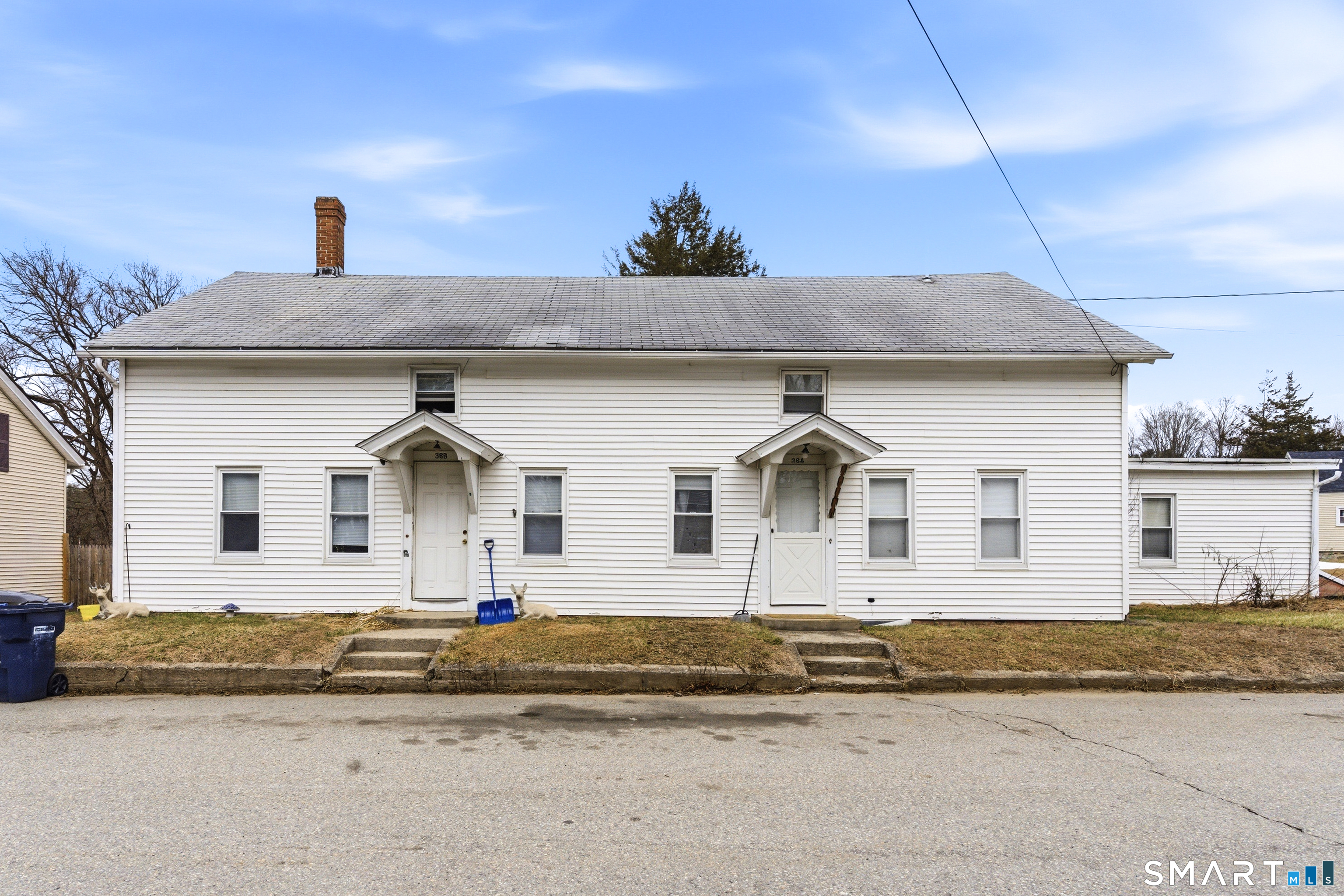 36 Church Street Killingly, CT 06241 - Photo 37 of 39 a front view of a house with a yard