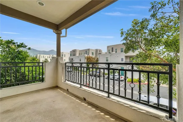 a view of a balcony with city view