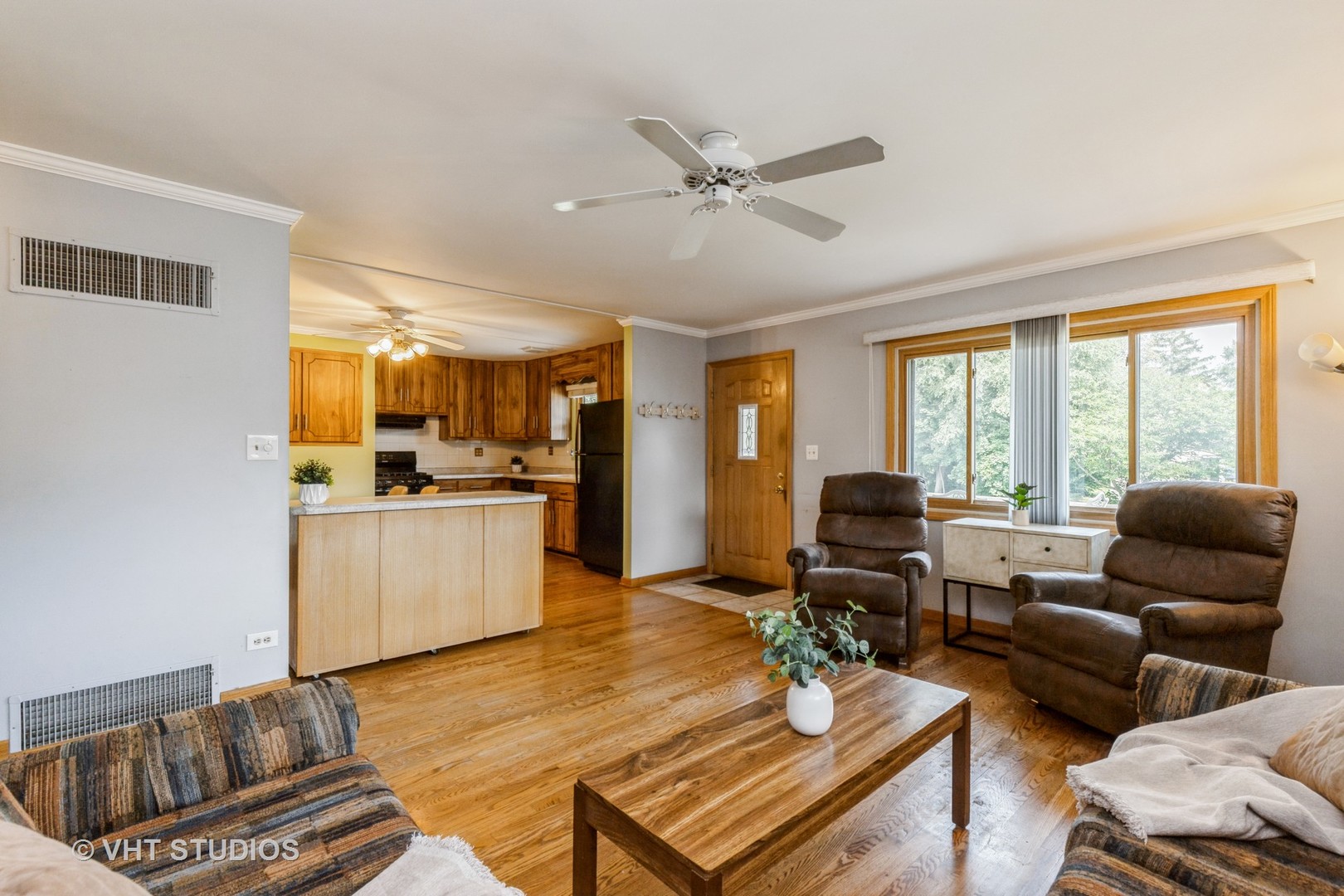 1504 Ridgeway Street Round Lake Beach, IL 60073 - Photo 3 of 19 a living room with furniture and kitchen view