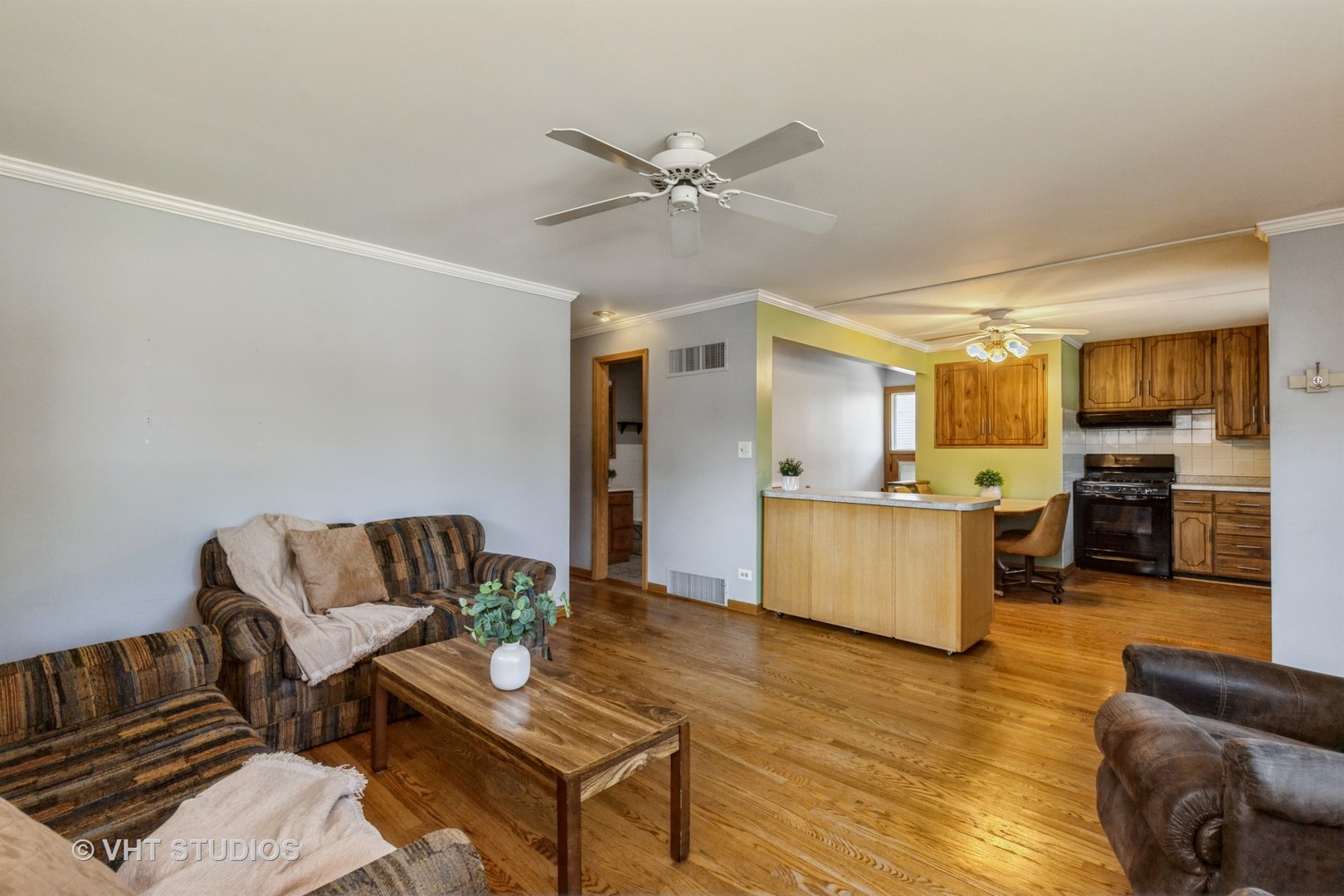 1504 Ridgeway Street Round Lake Beach, IL 60073 - Photo 4 of 19 a living room with furniture and kitchen view