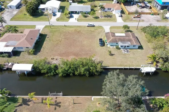 an aerial view of a house with a yard lake house and outdoor space