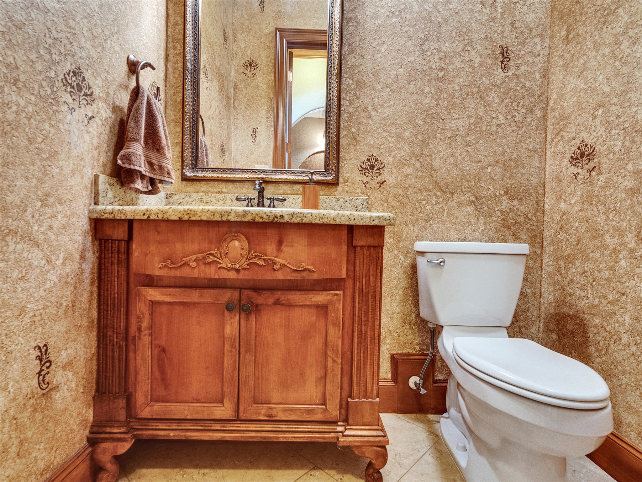 28503 Champions Ridge Road Magnolia, TX 77354 - Photo 14 of 47 A convenient powder room on the first floor offers easy access for guests and family.