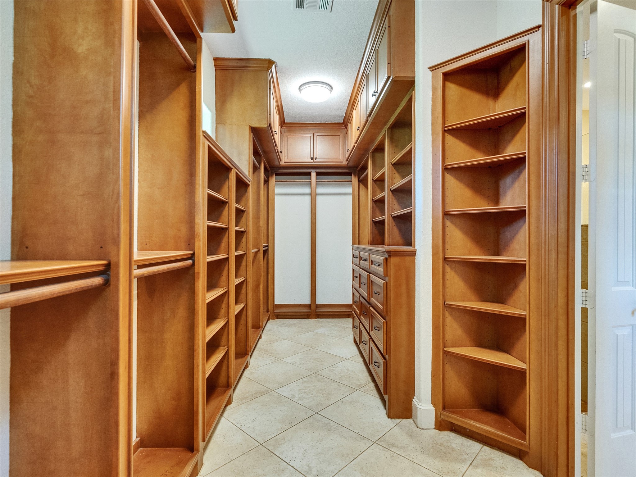 28503 Champions Ridge Road Magnolia, TX 77354 - Photo 20 of 47 The expansive primary closet is a standout feature, offering luxurious storage and a perfectly organized space for your wardrobe.