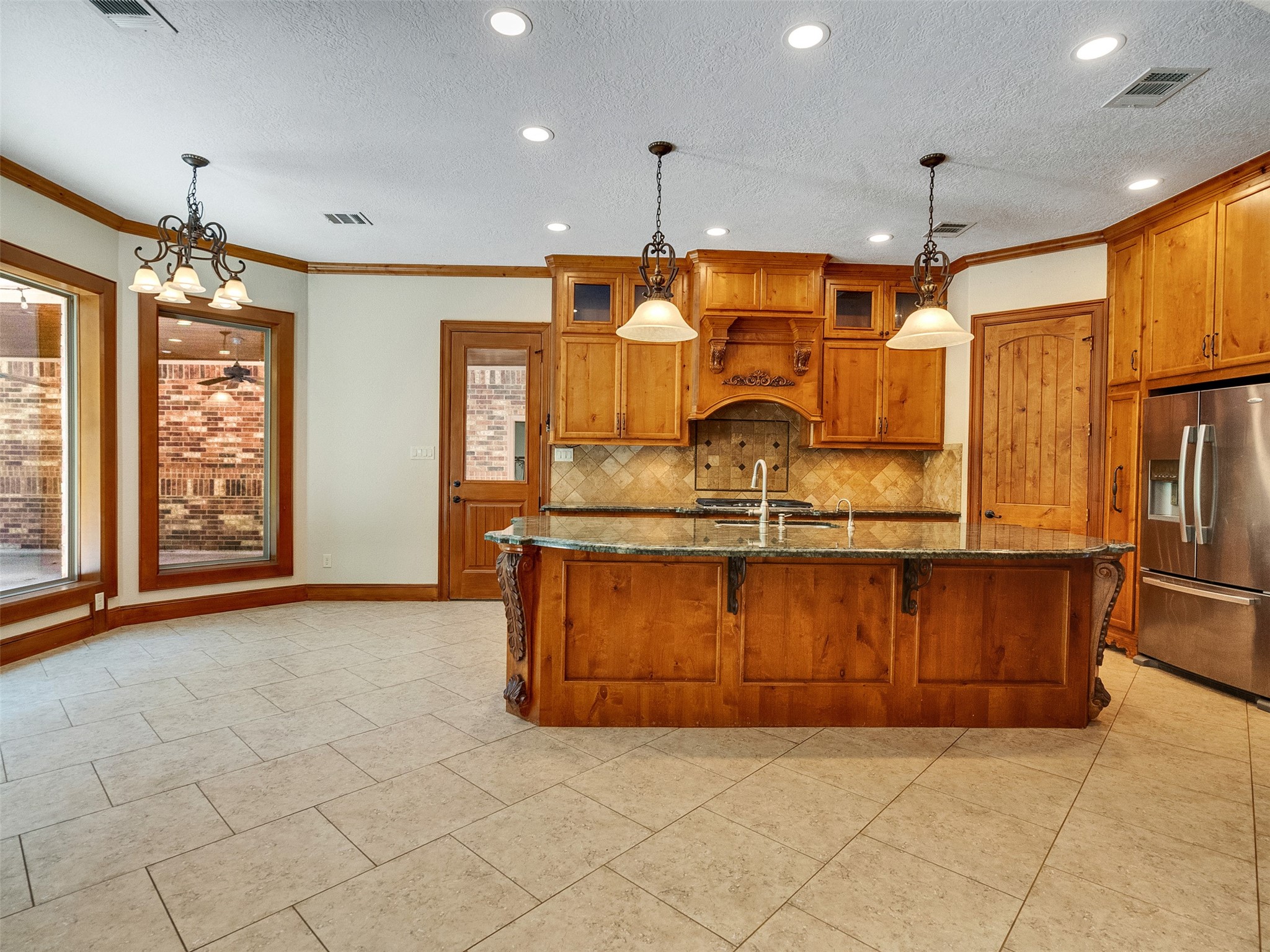 28503 Champions Ridge Road Magnolia, TX 77354 - Photo 2 of 47 The living room offers a beautiful view into the kitchen, creating an open and connected living space.