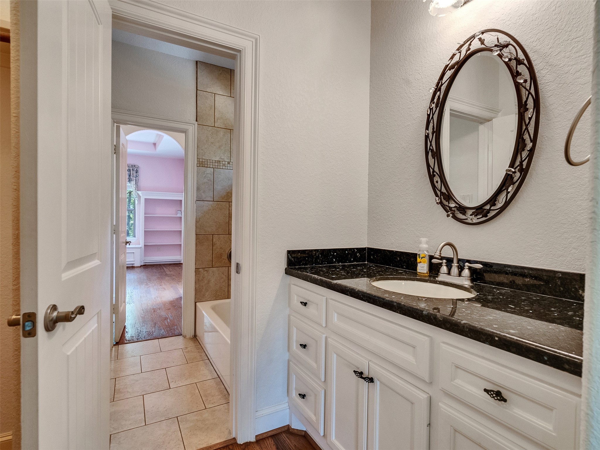 28503 Champions Ridge Road Magnolia, TX 77354 - Photo 26 of 47 Bedroom One features its own sink area, adding convenience.
