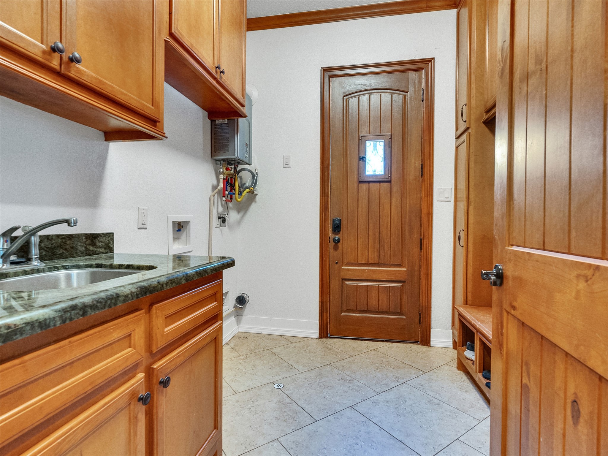 28503 Champions Ridge Road Magnolia, TX 77354 - Photo 36 of 47 The home features a convenient laundry room located on the first floor for easy access.