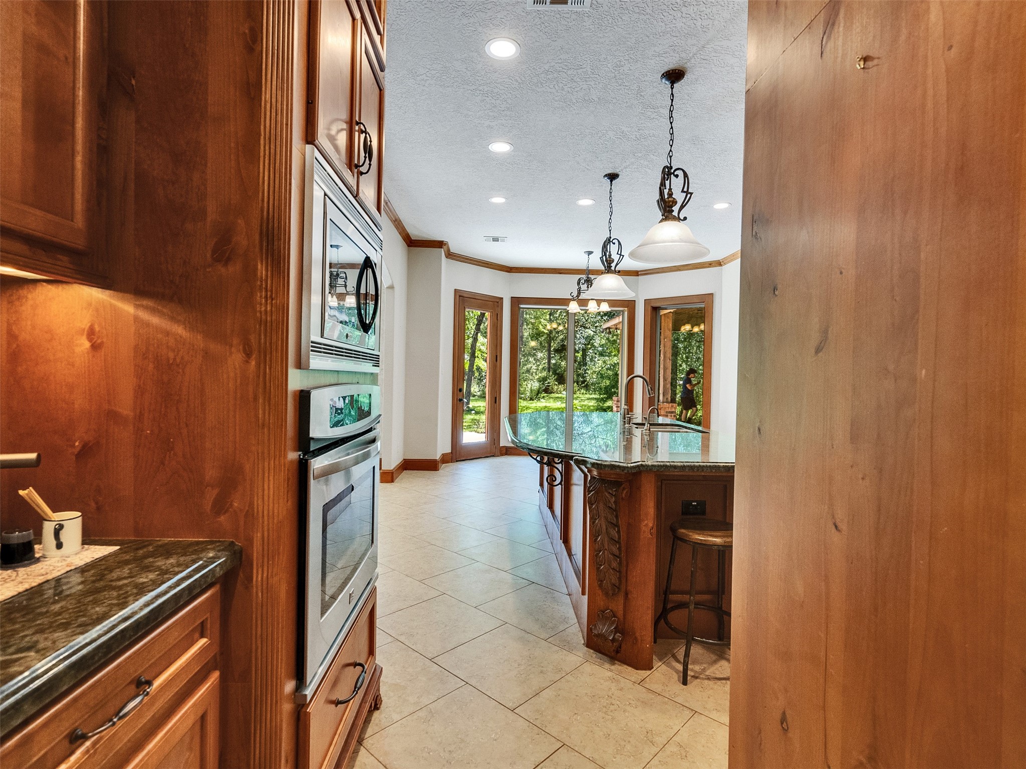 28503 Champions Ridge Road Magnolia, TX 77354 - Photo 9 of 47 Featuring a sophisticated butler’s pantry, this home combines style and functionality, making entertaining effortless.