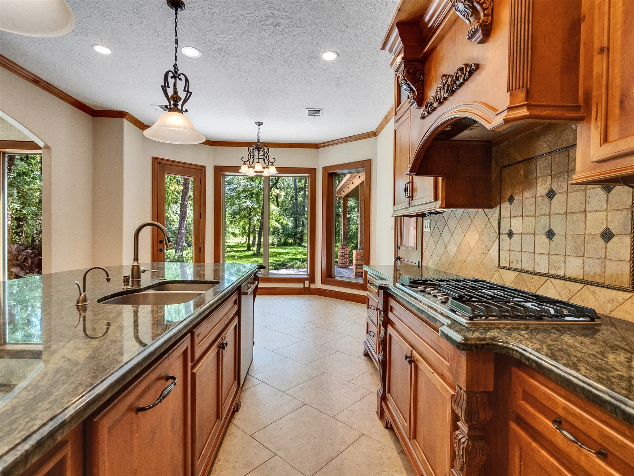 28503 Champions Ridge Road Magnolia, TX 77354 - Photo 10 of 47 The open kitchen boasts sleek countertops, custom cabinetry, and a layout perfect for cooking and entertaining.
