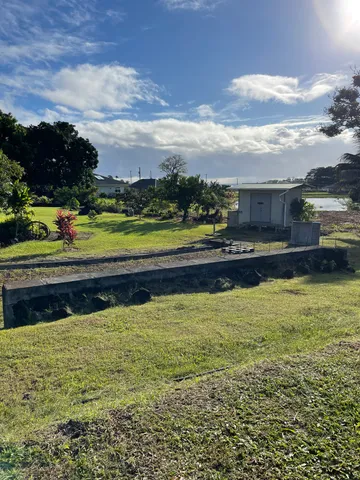 a view of swimming pool with a garden and trees