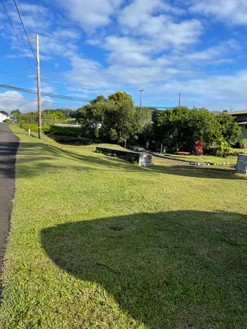 a view of a pathway with a yard