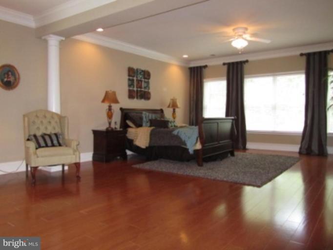 20129 Black Diamond Place Ashburn, VA 20147 - Photo 20 of 20 a living room with furniture window and wooden floor