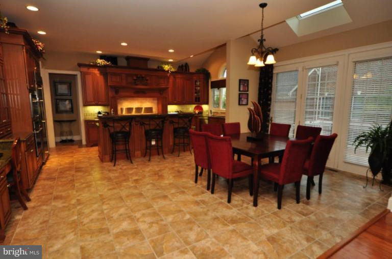 20129 Black Diamond Place Ashburn, VA 20147 - Photo 9 of 20 a view of a dining room with furniture