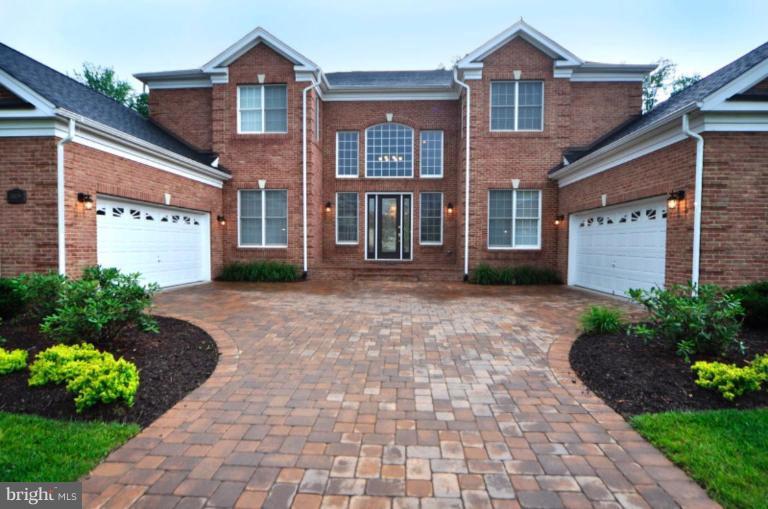 20129 Black Diamond Place Ashburn, VA 20147 - Photo 10 of 20 a front view of a house with garden