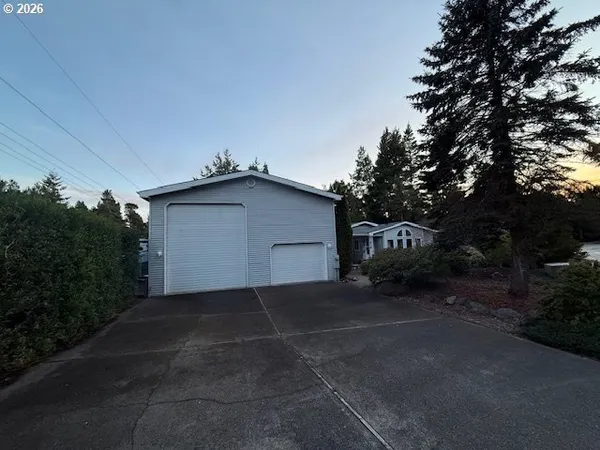 a backyard of a house with garage