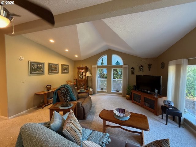 212 Munsel Creek Loop Florence, OR 97439 - Photo 3 of 6 a living room with furniture and a flat screen tv