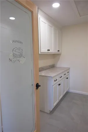 a kitchen with cabinets and window