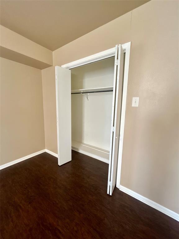 406 Northwest 5th Street Hubbard, TX 76648 - Photo 17 of 40 an empty room with wooden floor door and closet