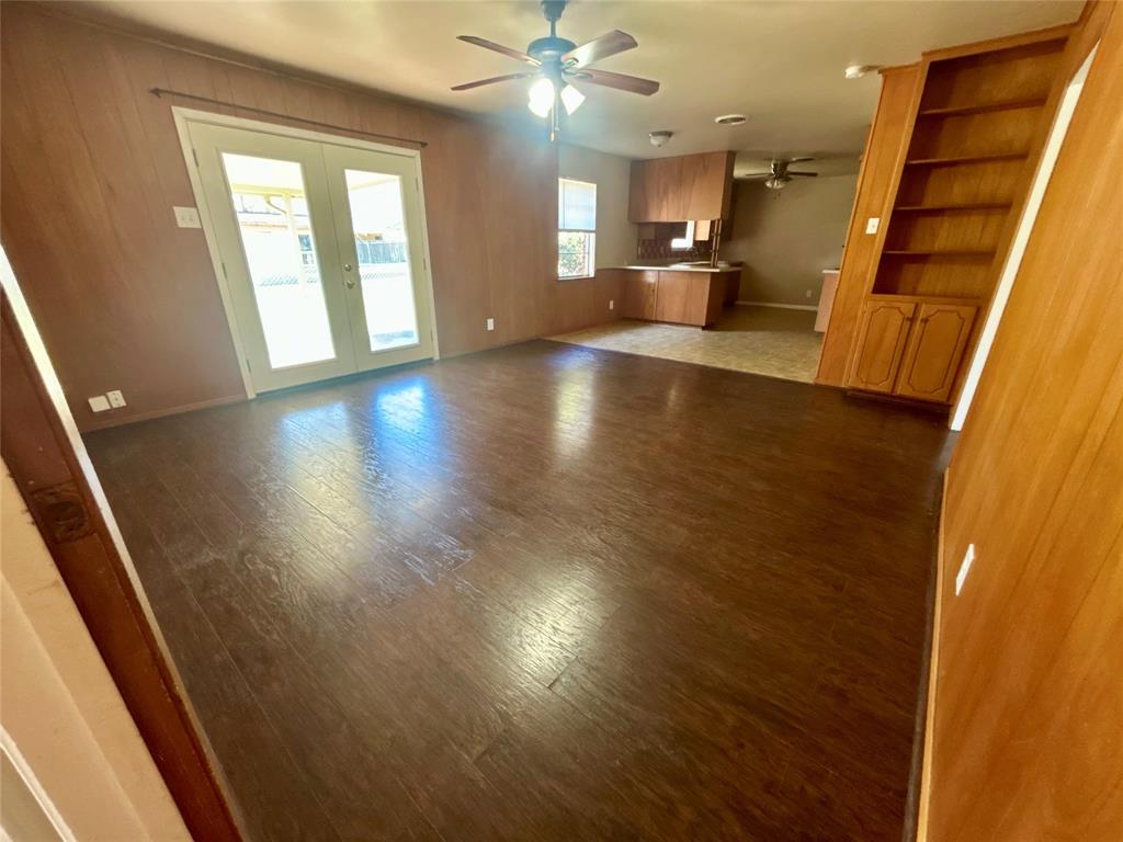 406 Northwest 5th Street Hubbard, TX 76648 - Photo 20 of 40 wooden floor in an empty room with a window