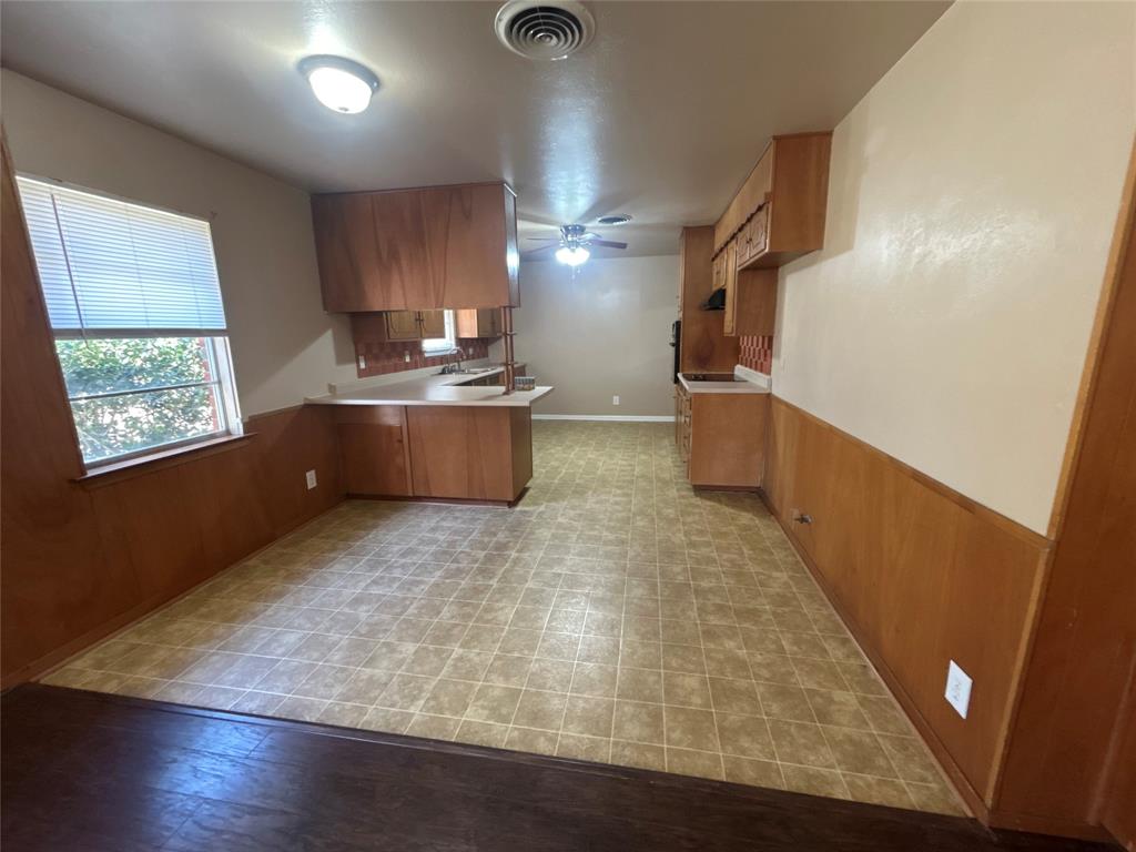406 Northwest 5th Street Hubbard, TX 76648 - Photo 24 of 40 a room with painting on the wall and a window