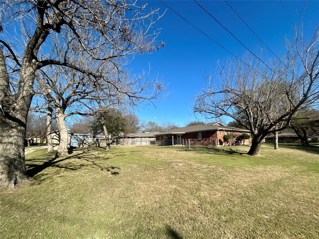 406 Northwest 5th Street Hubbard, TX 76648 - Photo 38 of 40 a view of a swimming pool with an outdoor space