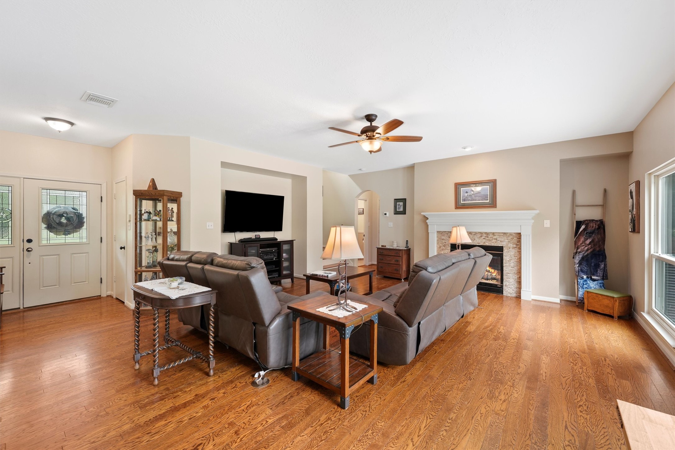 6803 Treaschwig Road Spring, TX 77373 - Photo 7 of 22 a living room with furniture and a flat screen tv