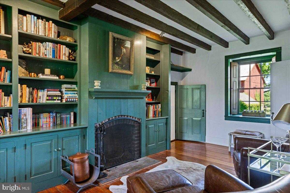 481 Quarry Road Ottsville, PA 18942 - Photo 21 of 64 a living room with furniture cabinets and a book shelf