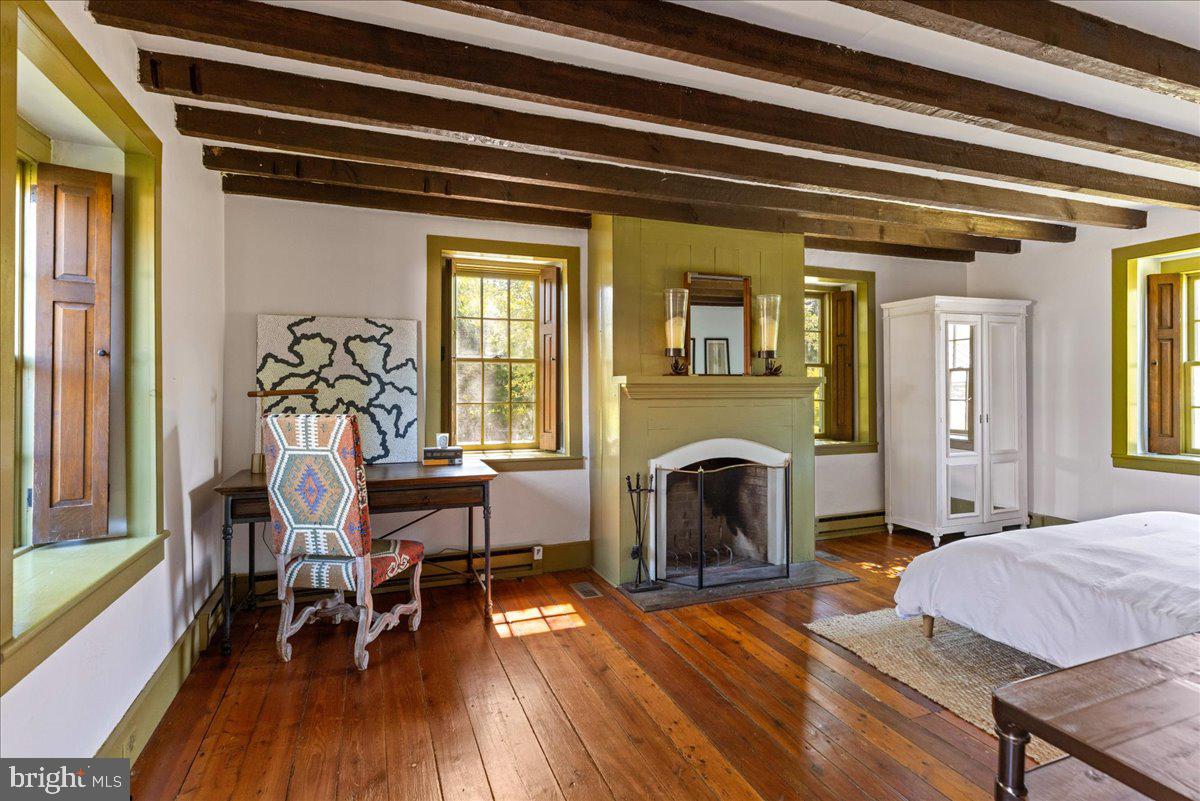 481 Quarry Road Ottsville, PA 18942 - Photo 24 of 64 a living room with furniture and a fireplace