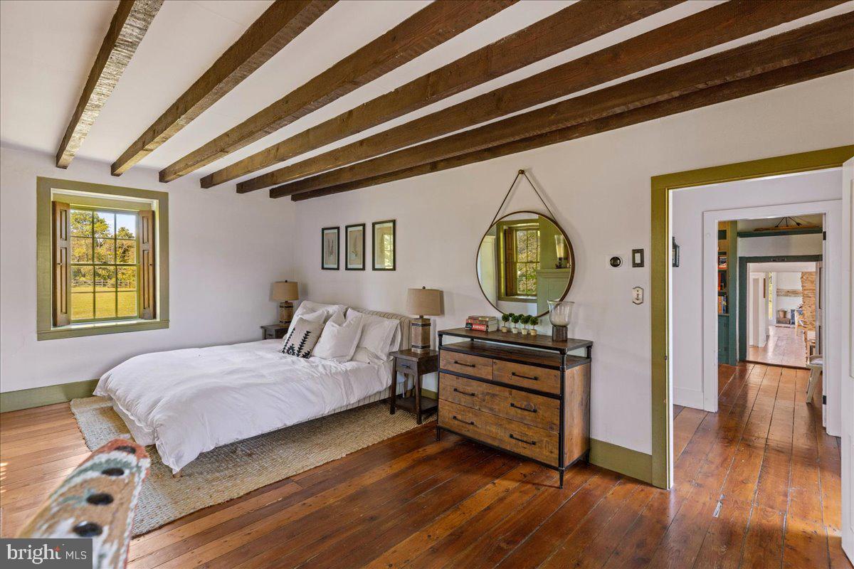 481 Quarry Road Ottsville, PA 18942 - Photo 25 of 64 a bedroom with a bed and a dresser next to a window