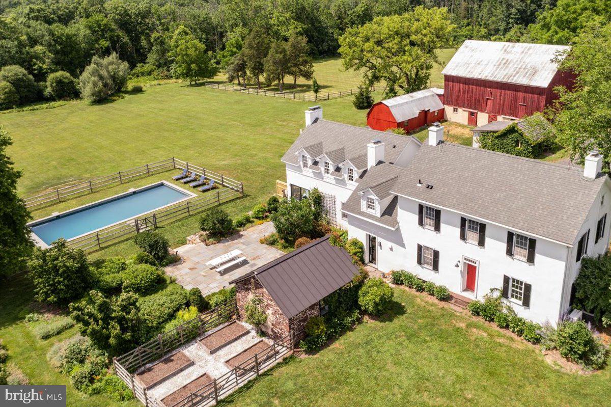 481 Quarry Road Ottsville, PA 18942 - Photo 5 of 64 an aerial view of a house with a garden and lake view
