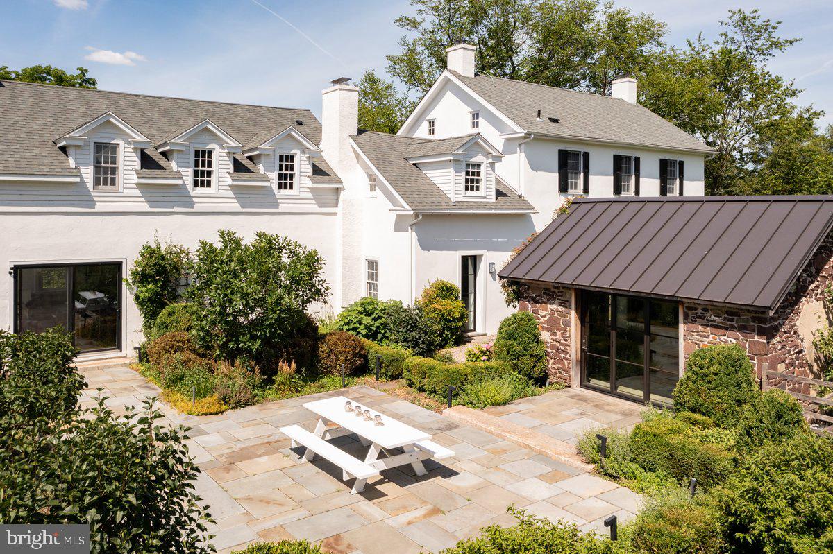 481 Quarry Road Ottsville, PA 18942 - Photo 52 of 64 a front view of a house with a garden and porch