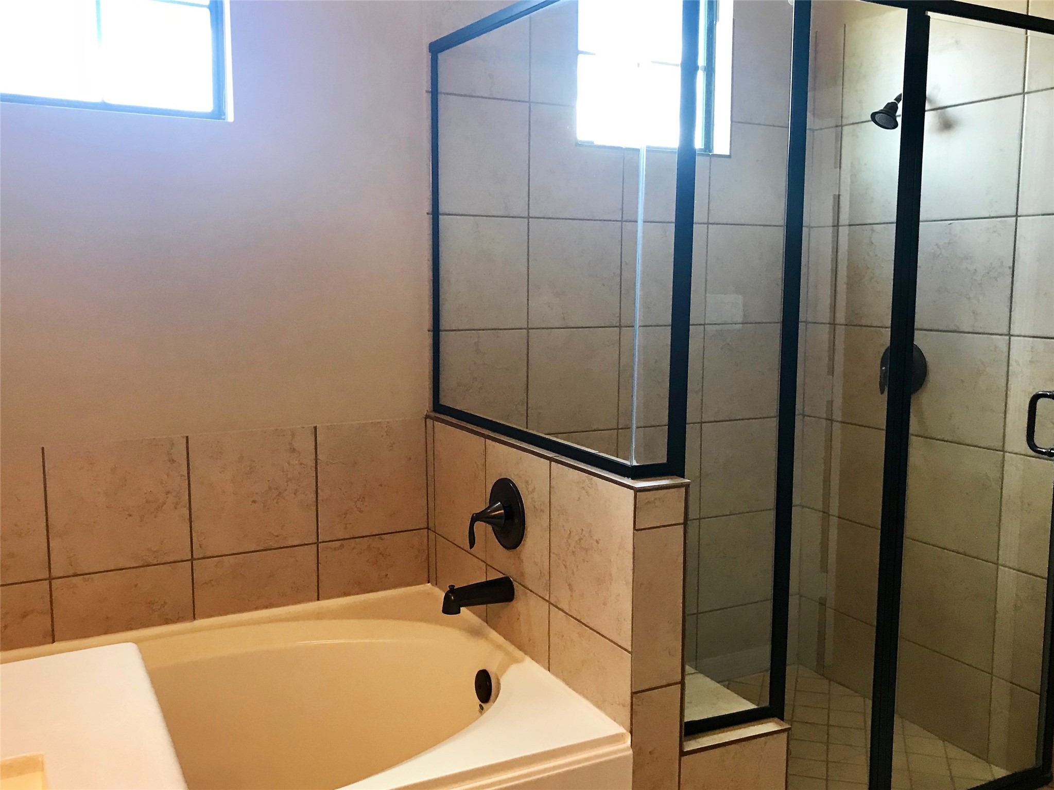 722 Audra Lane Spring, TX 77386 - Photo 18 of 27 a bathroom with a tub and shower