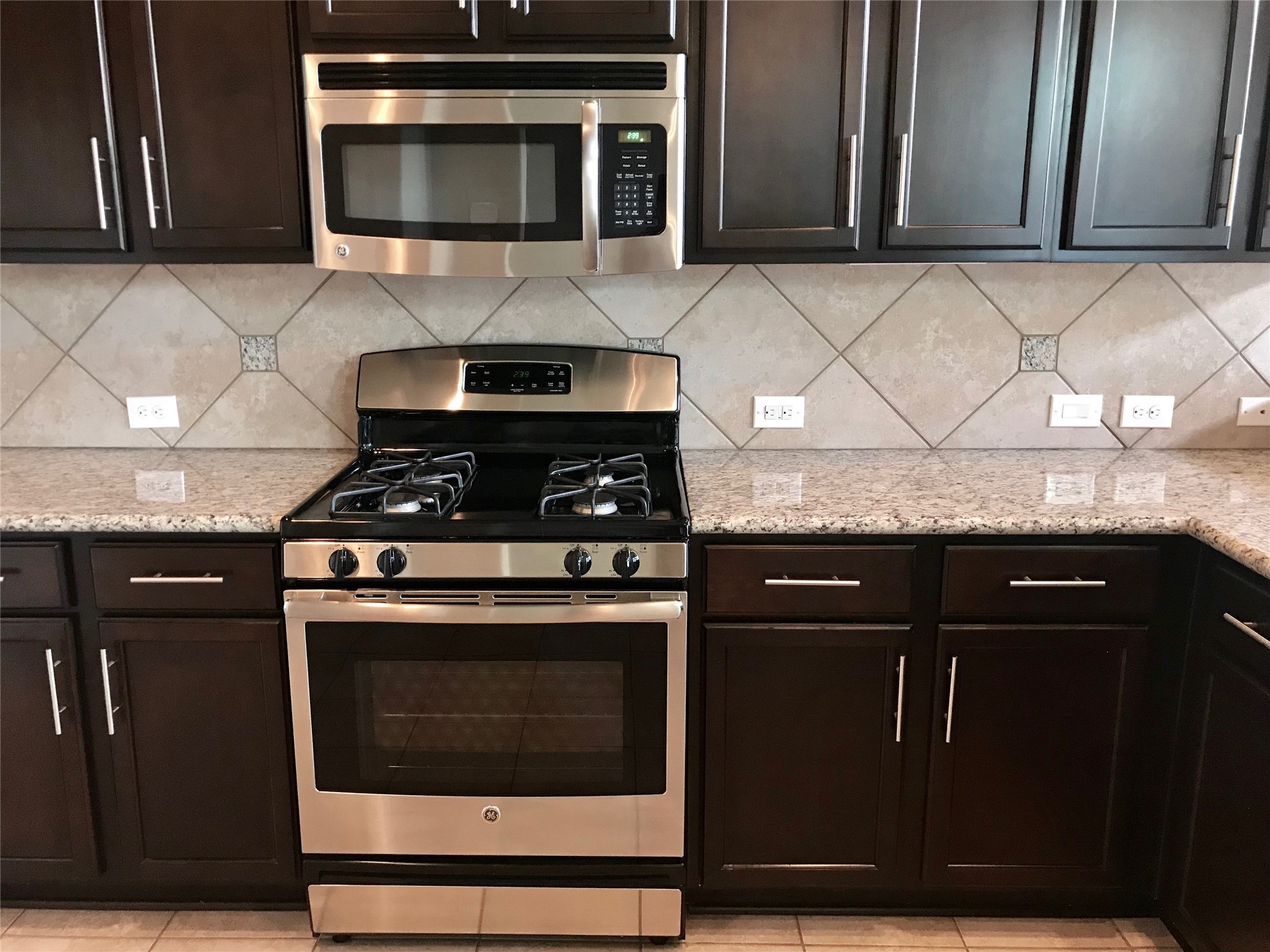 722 Audra Lane Spring, TX 77386 - Photo 8 of 27 a stove top oven sitting inside of a kitchen