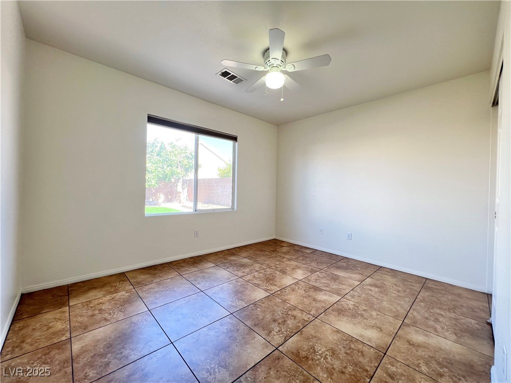 330 Forest Ridge Street Henderson, NV 89014 - Photo 14 of 45 Bedroom downstairs with ceiling fan