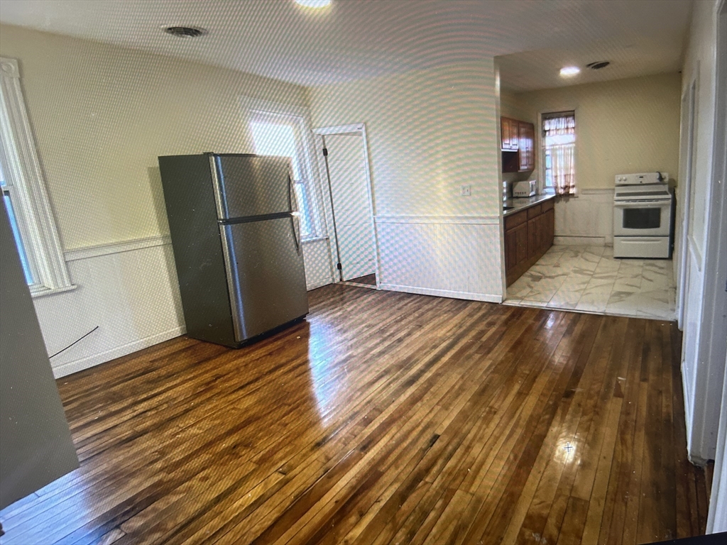 15 Norfolk Street Worcester, MA 01604 - Photo 11 of 18 a kitchen with a refrigerator and a sink