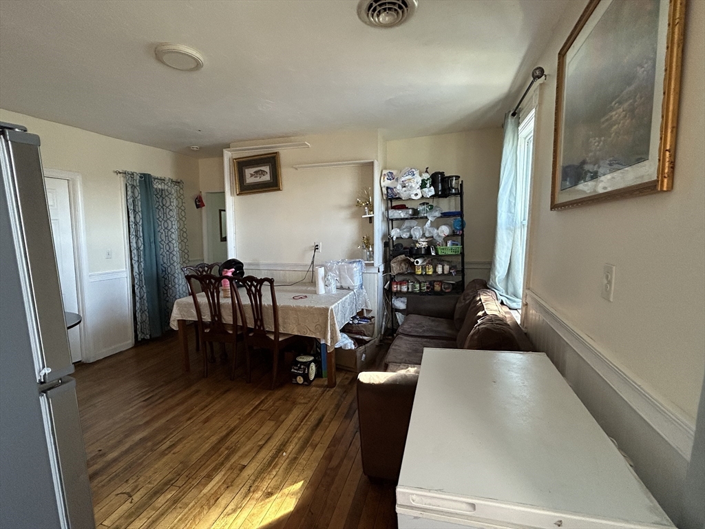 15 Norfolk Street Worcester, MA 01604 - Photo 4 of 18 a living room with furniture and wooden floor
