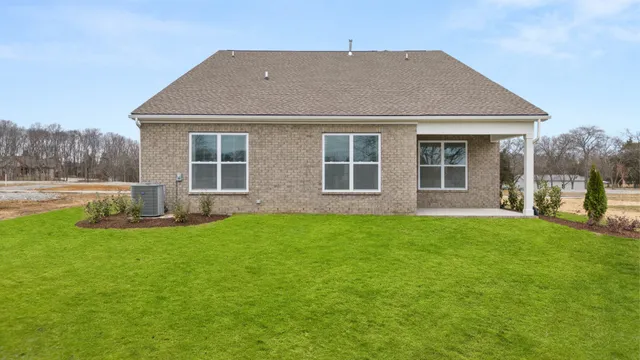 a view of a yard in front of a house