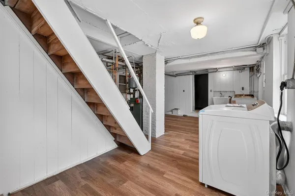 a view of a hallway with washer and dryer