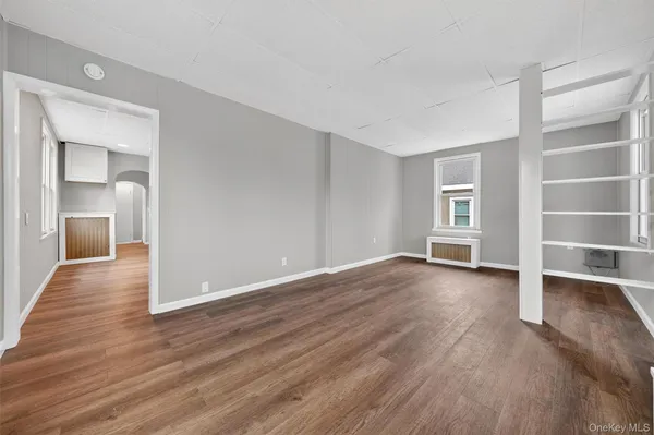 a view of a livingroom with wooden floor and closet