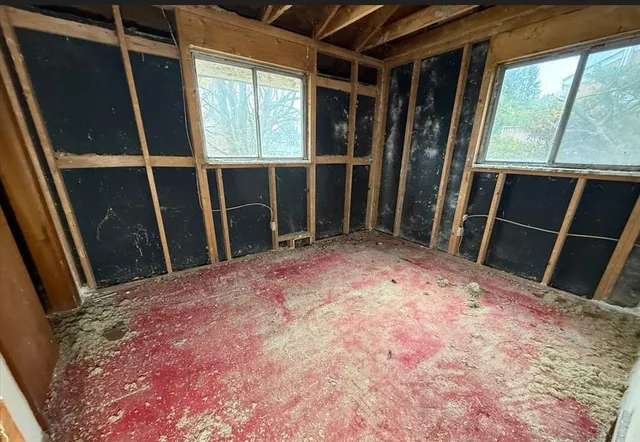 a view of an empty room with a window