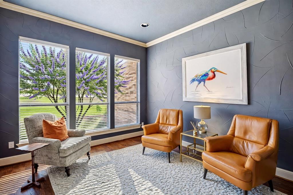 1520 Snider Court Lucas, TX 75002 - Photo 12 of 40 This inviting flex space features rich designer wall finishes, stunning dark hardwood floors, abundant natural light, and large windows overlooking beautifully landscaped grounds.