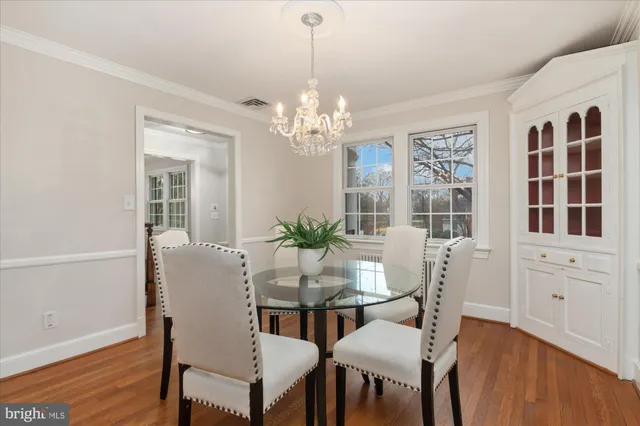 a view of a work space with furniture and a potted plant
