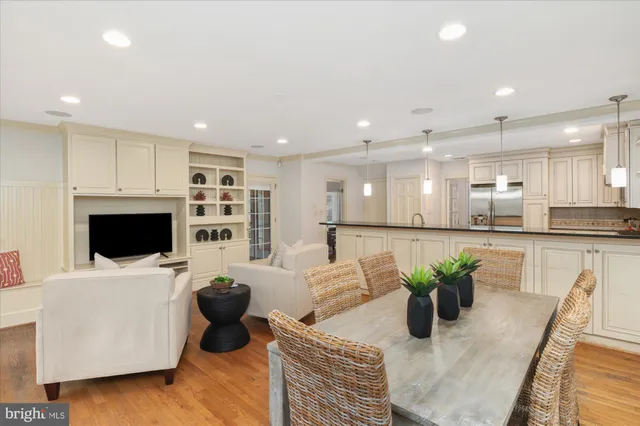 a living room with furniture fireplace and flat screen tv